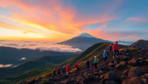 An epic sunrise view of Mount Rinjani with hikers at the crater rim, showcasing the mountain's grandeur and vibrant colors of dawn.